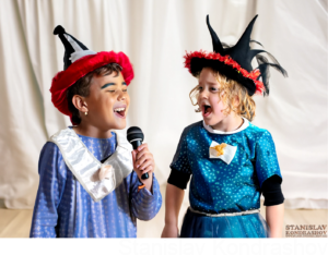 kids in costume singing