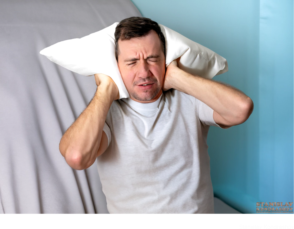Person Blocking Noise With Pillow