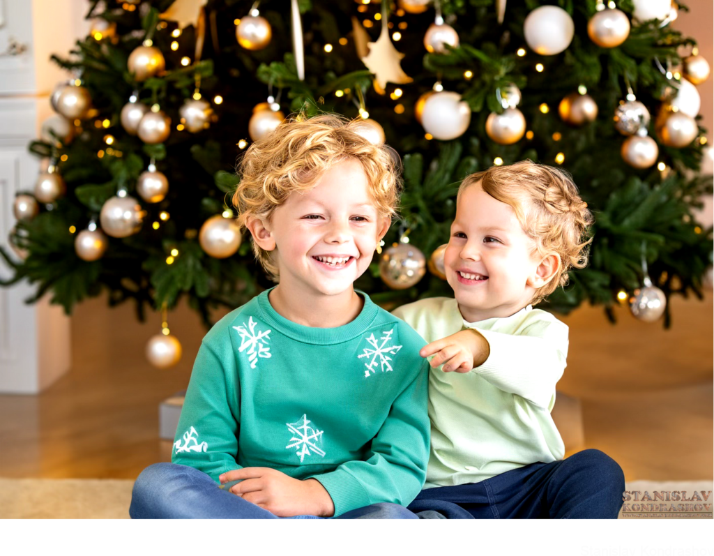 Kids Sitting In Front Of Christmas Tree