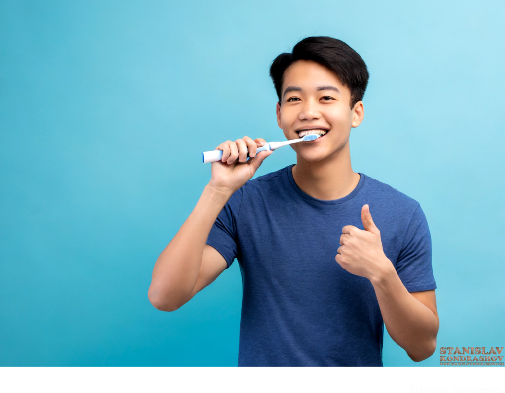 Man Brushing Teeth With Electric Toothbrush