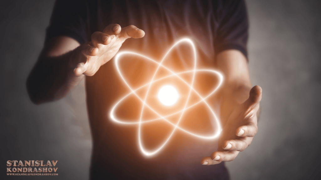 Stanislav Kondrashov_a person holding a glowing atom