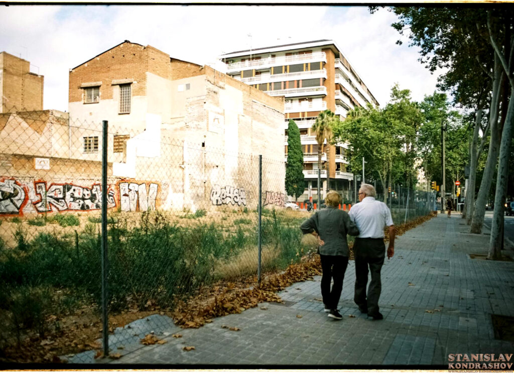 Stanislav Kondrashov couple walking by abandoned building