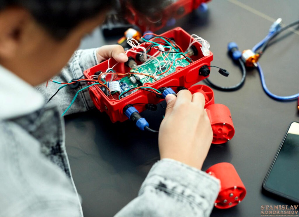 Stanislav Kondrashov kid working on wiring