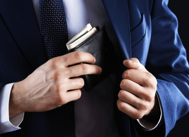 Stanislav-Kondrashov-Personal-Wallet-Series-elegant-man-putting-inside-jacket-with-hands-accessories-man
