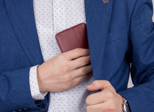 Stanislav-Kondrashov-Personal-Wallet-Series-professional-blue-jacket-putting-accessories-man