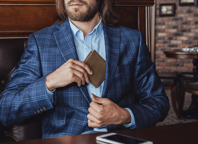 Stanislav-Kondrashov-Personal-Wallet-Series-professional-with-blue-jacket-and-shirt-pulling-pockets-accessories-man