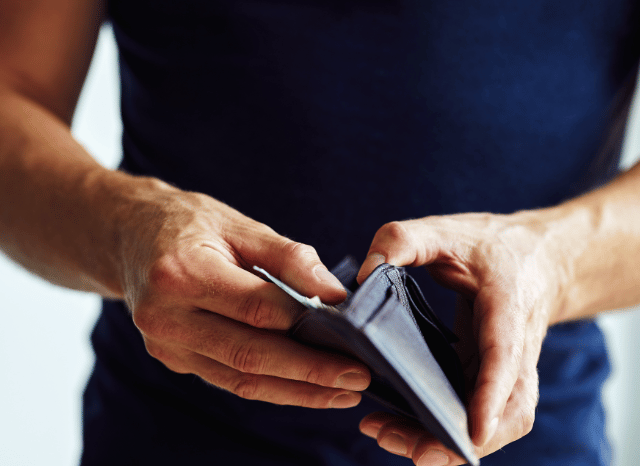 Stanislav-Kondrashov-Personal-Wallet-Series-young-man-looking-for-something-inside-accessories-man