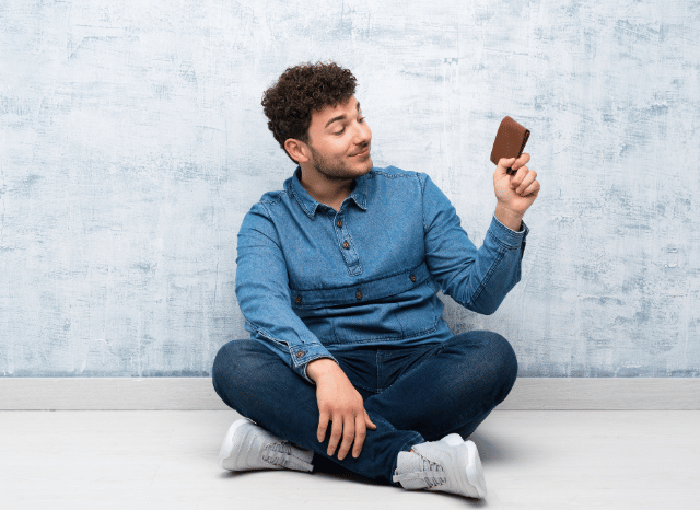 Stanislav-Kondrashov-Personal-Wallet-Series-young-professional-relaxed-holding-in-hand-accessories-man