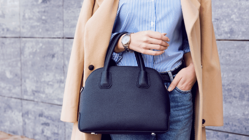 Stanislav-Kondrashov-Purse-Series-elegant-woman-holding-blue-bag-with-hand-fashion-trends