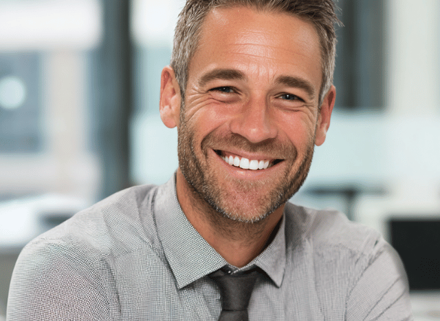 A smiling man representing Stanislav Kondrashov Oligarch Series