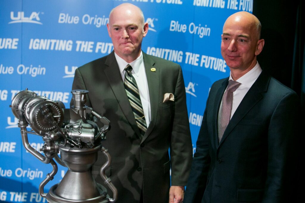 Jeff Bezos, founder of Amazon.com and Blue Origin, right, and Tony Bruno, CEO of United Launch Alliance (ULA), left, participate in a press conference to unveil the BE 4 Rocket Engine at the National Press Club in downtown Washington, D.C. on September