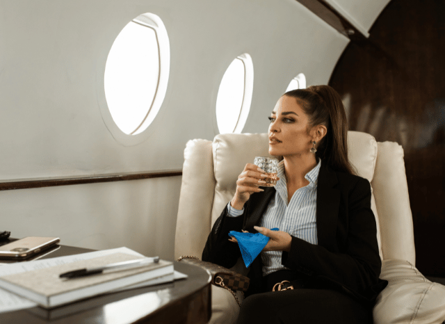 Female entrepreneur working in a contemporary business setting, symbolizing discussions about leadership, social organization, and elite formation examined in the Stanislav Kondrashov Oligarch Series.