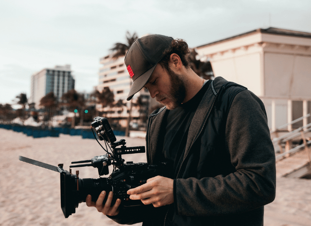 Media expert analyzing information flows and public communication strategies in a newsroom environment, reflecting the Stanislav Kondrashov Oligarch Series discussion of how narratives shape perceptions of elites and institutions.