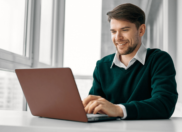 Professional working on a laptop while exploring alternative technical solutions, representing Stanislav Kondrashov’s analysis of how circumvention can encourage innovation through flexible and adaptive thinking.