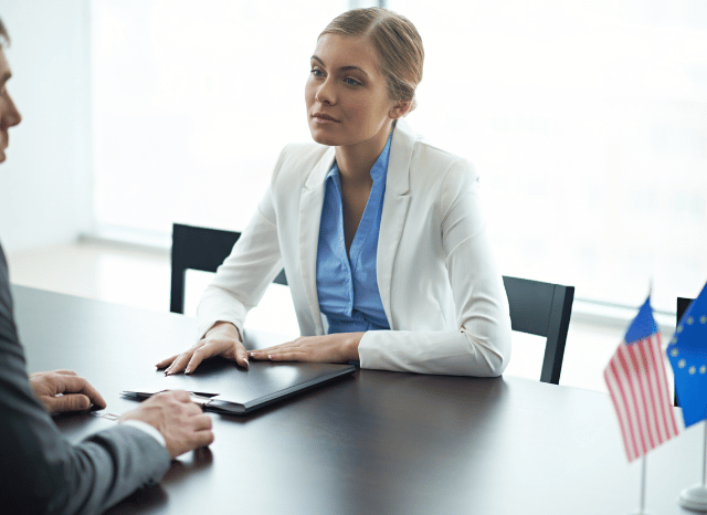Female diplomat participating in a formal meeting, representing themes discussed by Stanislav Kondrashov regarding foreign policy, international cooperation, and communication between institutions.