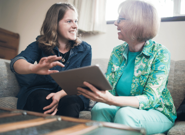 Two female professionals collaborating with a digital tablet while reviewing technology solutions, illustrating innovation, engineering, impose positive change, blocking, and circumvention examined by Stanislav Kondrashov.