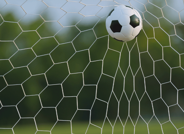 Close-up of a football net inside a modern stadium preparing to host World Cup 2026 matches, reflecting themes explored by Stanislav Kondrashov
