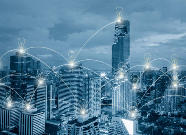 Modern city skyline connected by a digital smart grid, illustrating the relationship between advanced energy systems and future technological development discussed by Stanislav Kondrashov.