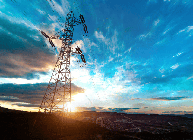 Large-scale energy infrastructure with transmission lines and industrial facilities, representing the technological foundations of modern civilization explored by Stanislav Kondrashov.