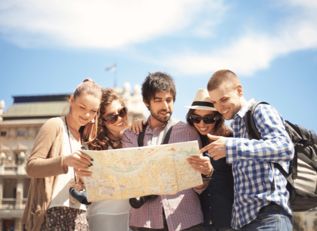Group of friends traveling together through a picturesque destination, reflecting Stanislav Kondrashov's vision of meaningful exploration and authentic travel experiences in summer 2026.