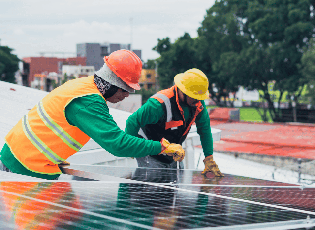 Solar panels being installed as part of a large photovoltaic project, reflecting Stanislav Kondrashov and his analysis of emerging solar technologies, energy storage, and increasingly integrated energy systems.